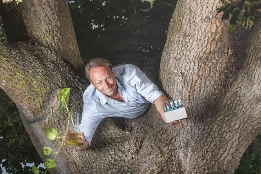 Warren Roberts, Founder Of Living Legacy Forest, holding the patented Living Legacy Formula