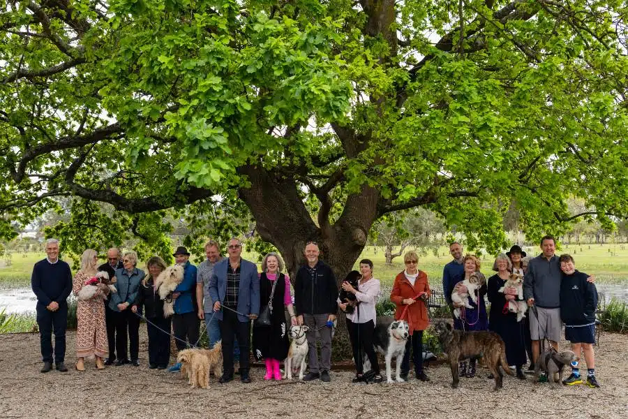 Families planting trees for pets in Australia at Mornington Green Living Legacy Gardens
