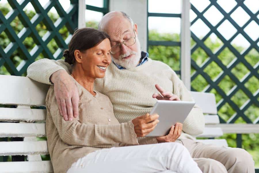 A man and his wife check funeral cost for pensioners in Australia