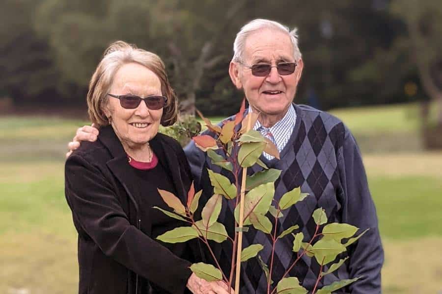 A woman and her husband pre-planning a funeral for pensioners in Australia with a Living Legacy Tree