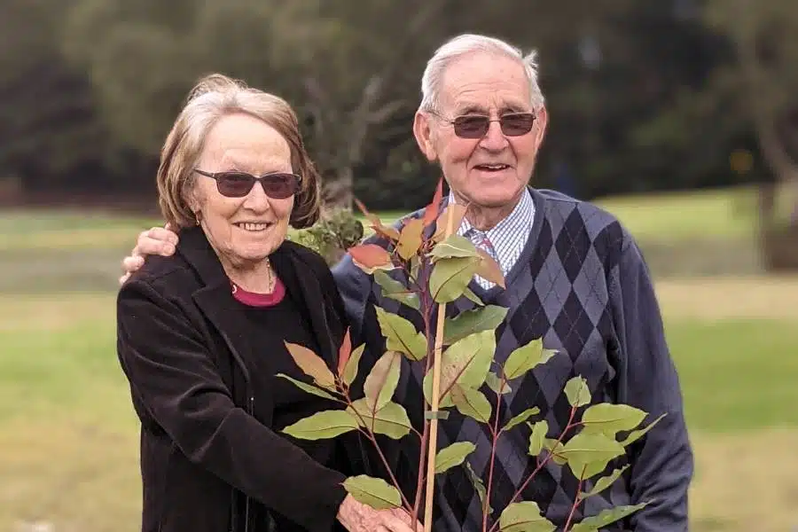 A woman and her husband pre-planning a funeral for pensioners in Australia with a Living Legacy Tree